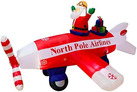 Сезона на сезонски божиќни надуени Дедо Мраз, летачки авион и пропелери на авион