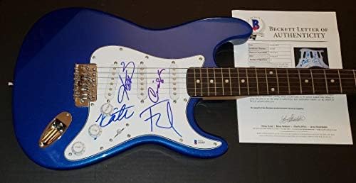 Б-бендот на Б-52, Фред Шнајдер Кејт, потпиша автограмирана гитара Бекет Бас